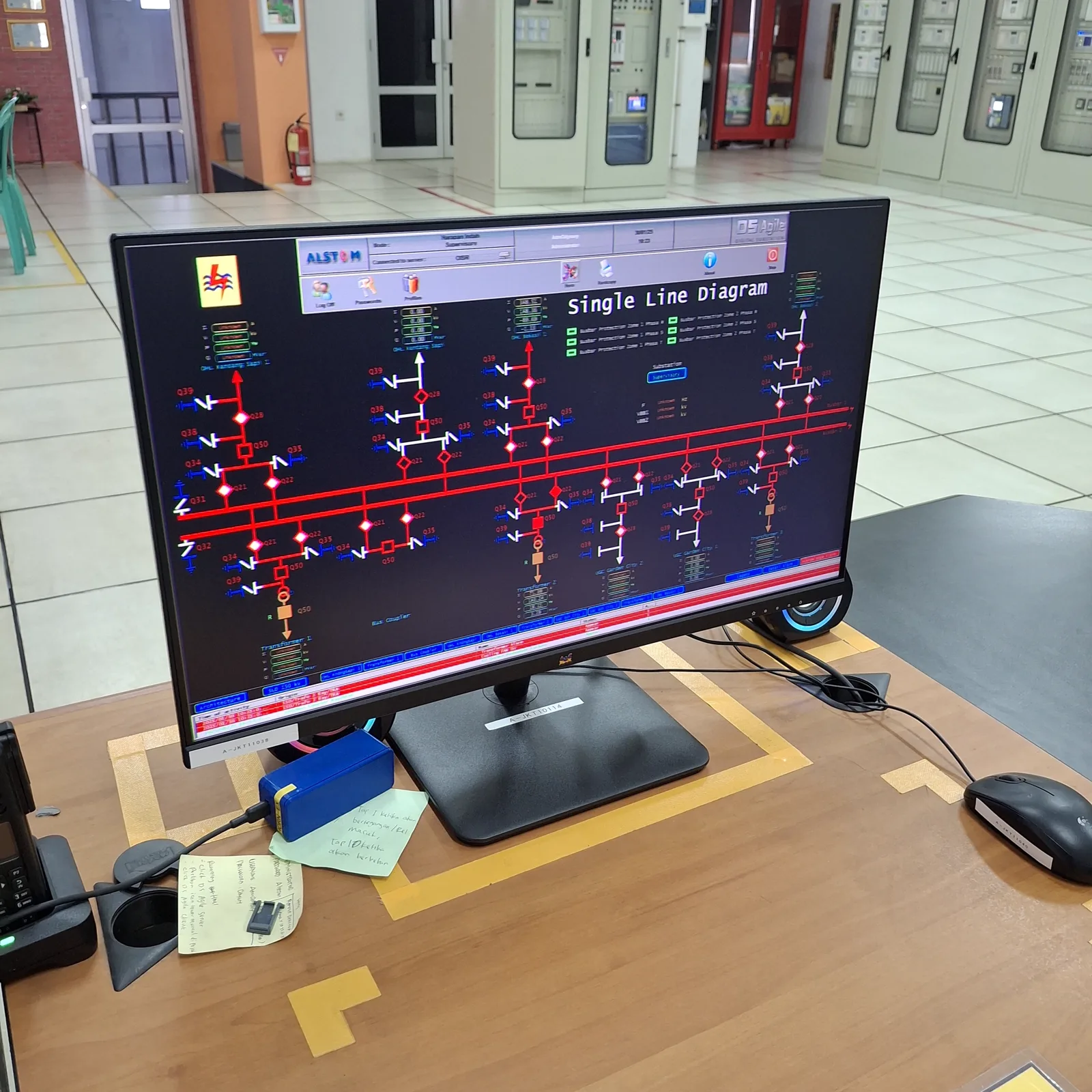 Substation SCADA single-line diagram on a control room monitor